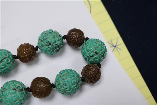 A carved turquoise and agate bead necklace.